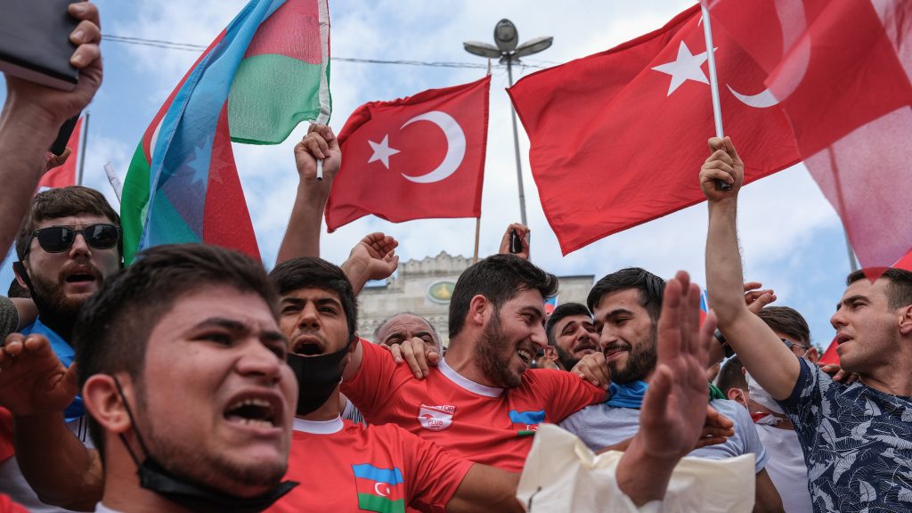 epa08554742 Ultra-nationalist Azerbaijani and Turkish people hold their national flags as they shout slogans against Armenia in front of the Istanbul University in Istanbul, Turkey, 19 July 2020. The two neighbors have been locked in conflict over Nagorno-Karabakh, a region of Azerbaijan that has been under the control of ethnic Armenian forces backed by Armenia since a war there ended in 1994. At least 16 people, including an army general, were killed in border clashes between Armenia and Azerbaijan.  EPA-EFE/SEDAT SUNA