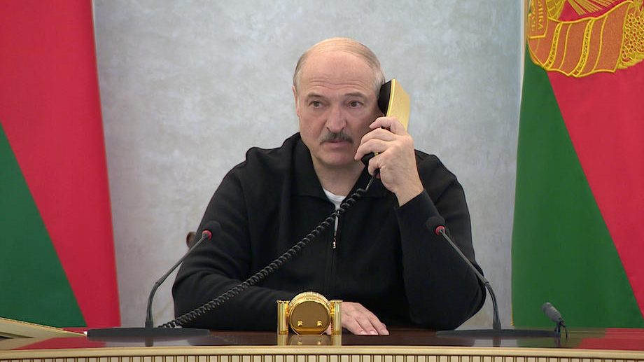 Belarusian President Alexander Lukashenko speaking on the phone at the Palace of Independence in Minsk