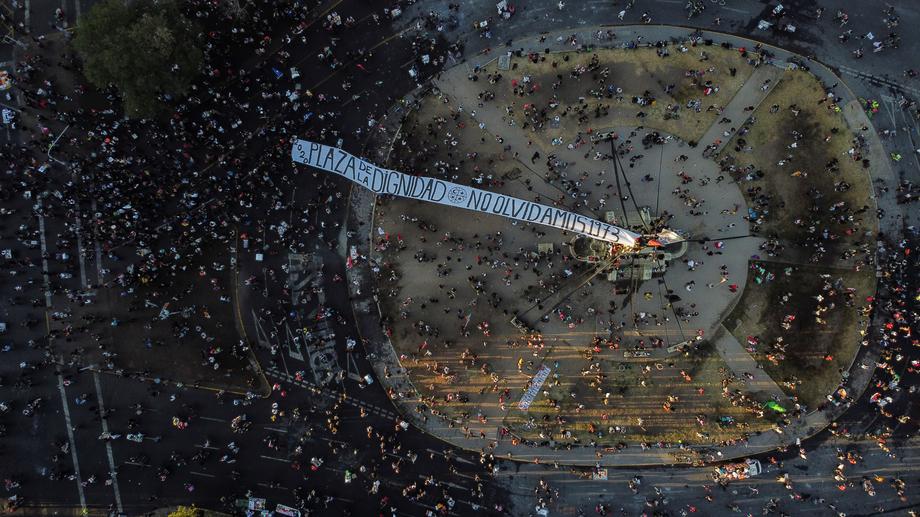 Demonstrators take over Plaza Italia prior to the result of the constitutional plebiscite in Chile