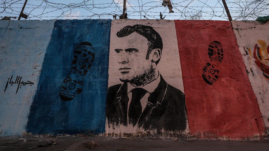 A mural against French President Macron in Gaza