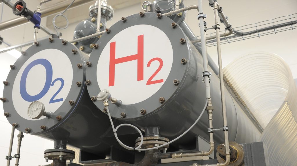 epa02980047 Two tanks marked with ‚O2‘ for oxygene and ‚H2‘ for hydrogene, part of the electrolysis installations, are seen at the first Hydrogene hybrid power plant that was inaugurated in Wittenhofe, near Prenzlau, Germany, on 25 October 2011. Powered by natural sources such as wind energy and bio gas the plant produces electricity and heat while an elektrolyzer uses exess energy to devide water into hydrogene and oxygene for storage. The stored hydrogene, in combination with bio gas can be burnt and re-converted into electrcity in case that the wind turbines are not producing enough energy.  EPA/BERND SETTNIK