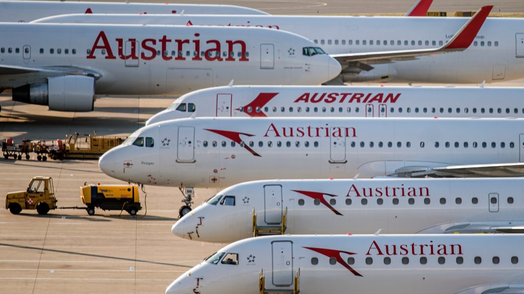 epa08406730 General view of Austrian Airlines (AUA) planes grounded at the Vienna International Airport (VIC) in Schwechat, Austria, 07 May 2020. According to media reports, AUA, part of the Lufthansa Group and headquartered in Vienna, Austria, is planning to cut 1,100 of the 7,000 jobs by 2023 and that wages are to fall by 13 per cent. The company temporarily suspended all regular flight operations due to the SARS-CoV-2 coronavirus, which causes the COVID-19 disease.  EPA-EFE/CHRISTIAN BRUNA