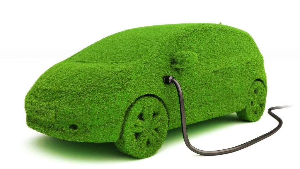 Alternative,Power,Concept,Eco,Car,.,Grass,Covered,Car,Plugged