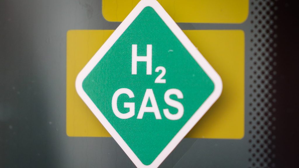 epa08562303 A hydrogen logo at a hydrogen production facility of the EWE in Elsfleth, northern Germany, 23 July 2020. The facility contains an electrolyzer and a hydrogen storage to produce hydrogen of renewable energies for fuel cell driven vehicles.  EPA-EFE/FOCKE STRANGMANN