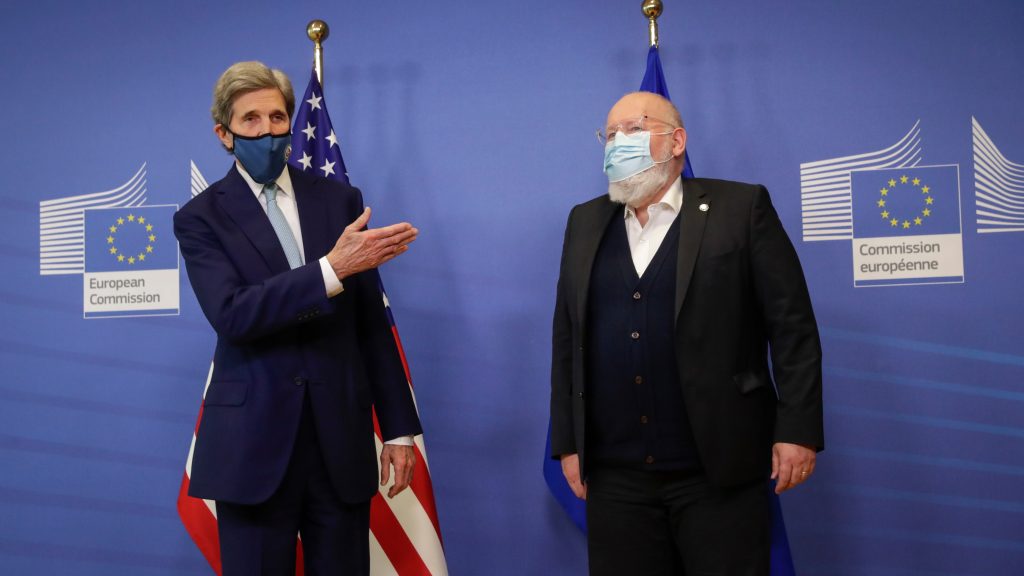 epa09063706 European Commission vice-president in charge for European green deal Frans Timmermans (R) welcomes US Special Presidential Envoy for Climate John Kerry (L) prior to a meeting in Brussels, Belgium, 09 March 2021.  EPA-EFE/OLIVIER HOSLET / POOL