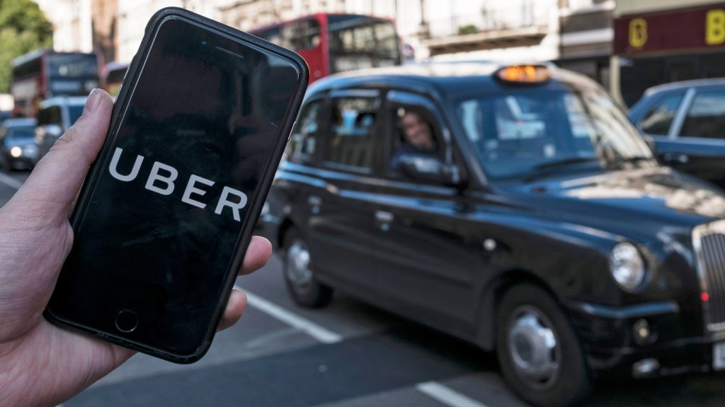 epa09023555  (FILE) – An image showing an Uber app on a mobile phone in central London, Britain, 22 September 2017 (re-issued 19 February 2021). The UK Supreme Court on 19 February 2021 ruled the Uber drivers are not not self-employed but workers. Uber, that has some 45,000 drivers working in London and that lost earlier court cases, said it would contact its active drivers across UK and discuss the operations. The ruling could mean Uber drivers may be entitled to holiday payments and minimum wages.  EPA-EFE/WILL OLIVER