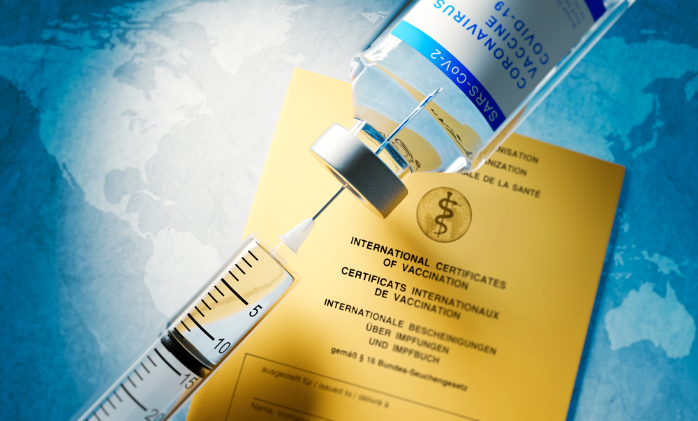 Vaccine,Concept,With,Syringe,,Vial,And,Yellow,International,Certificate,Of
