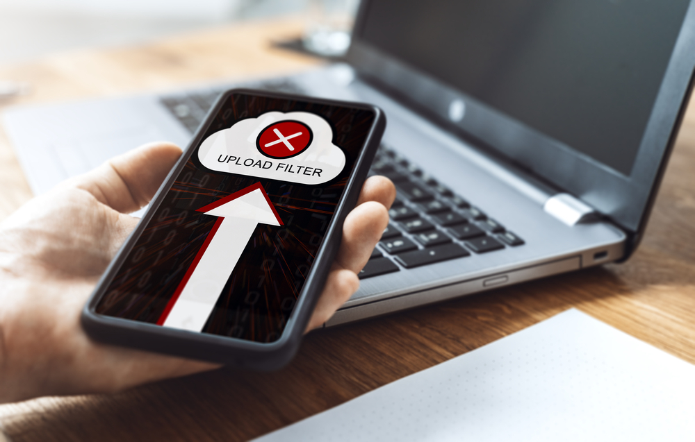 Smartphone,And,Notebook,On,Which,An,Upload,Was,Refused,Due