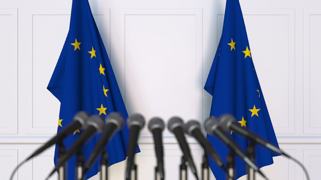 Official,Press,Conference.,Flags,Of,The,European,Union,Eu,And