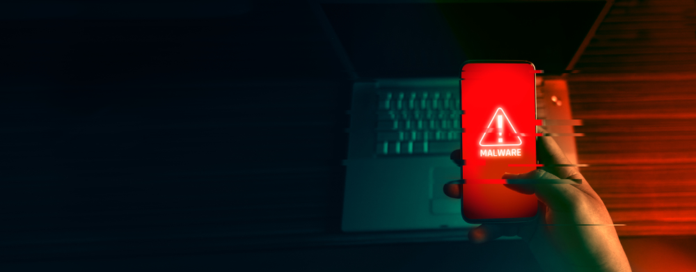An,Anonymous,Hacker,And,Uses,A,Malware,With,Mobile,Phone