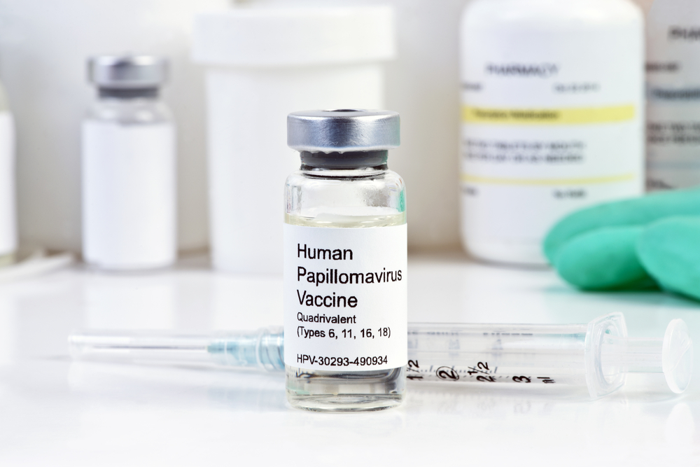 Human,Papilloma,Virus,Vaccine,With,Syringe,And,Vial,On,White