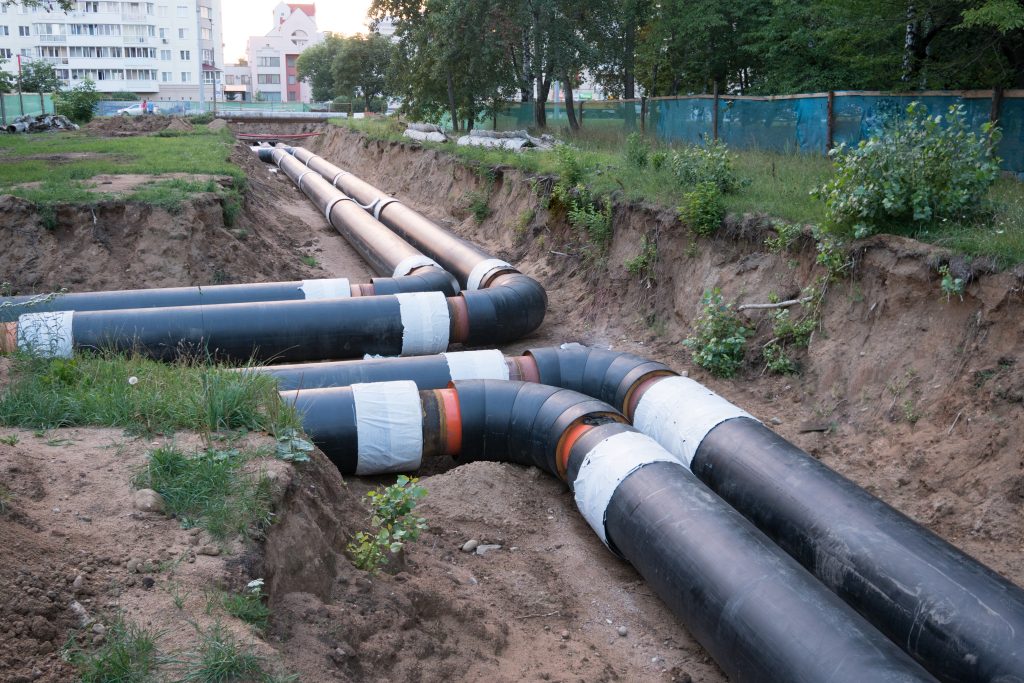 Laying,Of,Heating,Pipeline,In,The,Trench,To,Provide,New