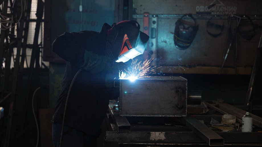epa09814520 A Ukrainian worker welds a portable wood-burning stove for use in the apartment if the gas and electricity are turned off during fights between Russian and Ukrainian troops in Zaporizhzhia, Ukraine, 10 March 2022. The city is preparing for a blockade by the Russian military. According to the United Nations High Commissioner for Refugees (UNHCR), Russia’s military invasion of Ukraine, which started on 24 February, has caused destruction of civilian infrastructure as well as civilian casualties, with tens of thousands internally displaced and over two million refugees fleeing Ukraine.  EPA-EFE/STANISLAV KOZLIUK
