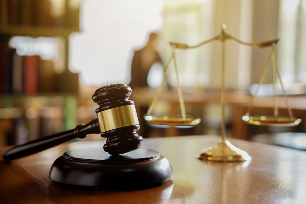 Judge,Gavel,With,Justice,Lawyers,Having,Team,Meeting,At,Law