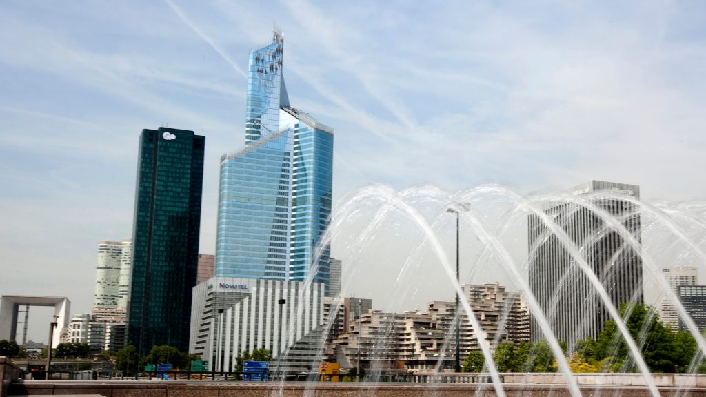 epa02720257 The ‚First Tower‘ (C) dominates the skyline of La Defense, the finance district in Western Paris, France, 06 May 2011. The tower, now deemed the tallest skyscraper in France, was inaugurated on 05 May 2011. It measures 231 meters – exceeding the height of Paris‘ Tour Montparnasse building. The new tower has required an investment of 320 million Euros. Ernst and Young, the first tenant to sign a contract with the owners, will move in in November 2011, with 3,100 of its employees, occupying a total of 33,500 meters square on 17 floors.  EPA/IAN LANGSDON