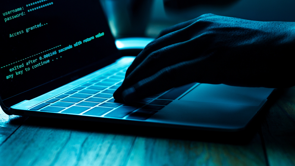 A,Computer,Programmer,Or,Hacker,Prints,A,Code,On,A