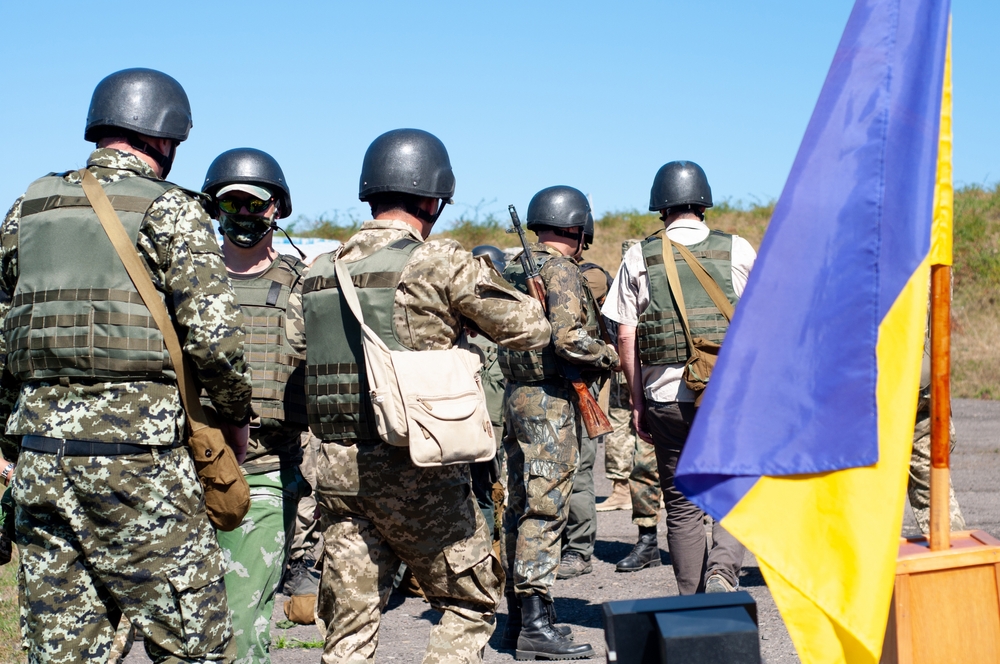 A,Group,Of,Armed,Ukrainian,Soldiers,Near,The,Flag,Of