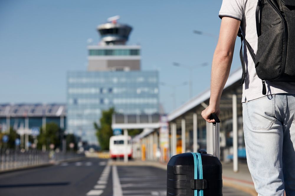 Passenger,Walking,From,Bus,Station,To,Airport,Terminal.,Selective,Focus