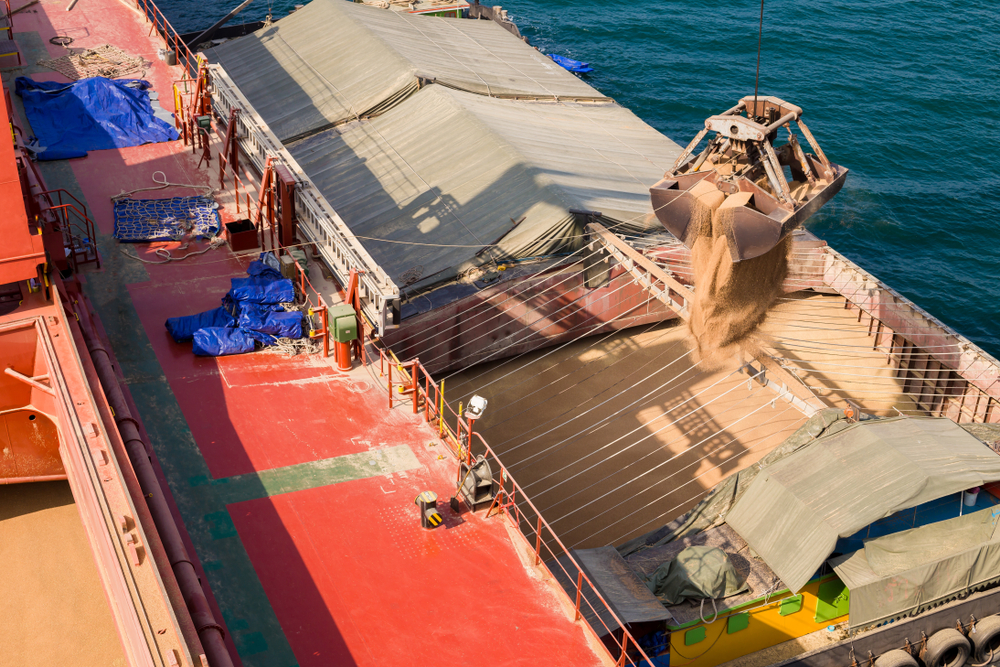 Loading,Wheat,On,Cargo,Ship,With,Crane,And,Bucket.,Shipment