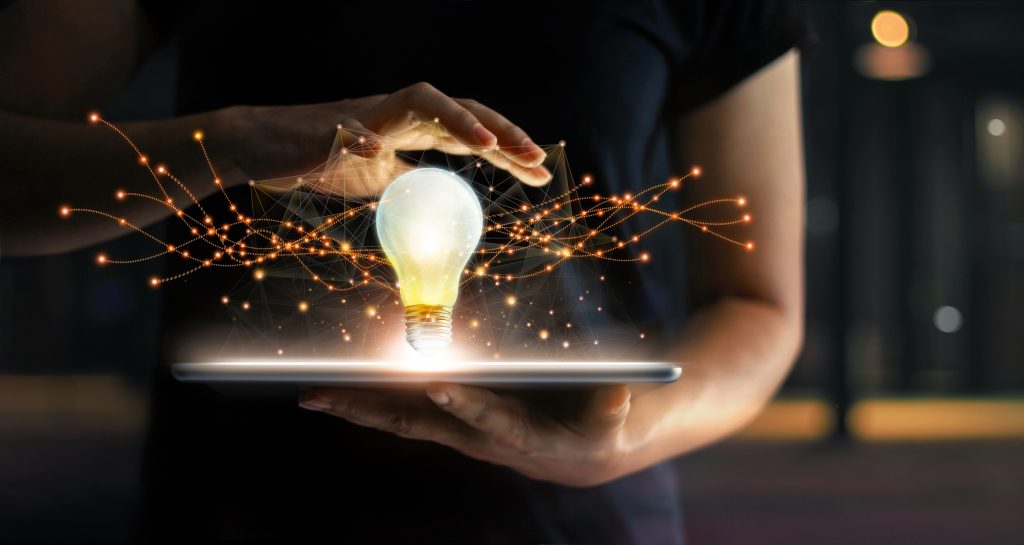 Abstract.,Innovation.,Hands,Holding,Tablet,With,Light,Bulb,Future,Technologies