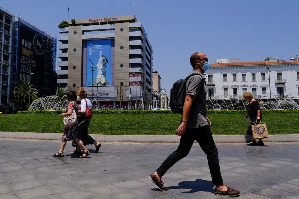 People,Walks,In,Omonia,Square,During,A,Hot,Day,In