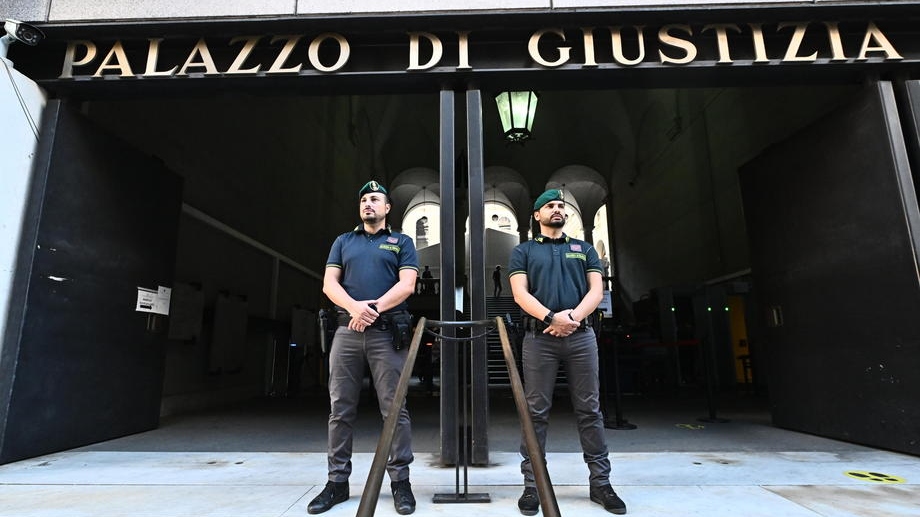 epa10056420 Financial Police officers stand guard outside a court in Genoa, Italy, 07 July 2022. The first hearing in the trial against 59 people for the 2018 Genoa bridge collapse starts on 07 July. On 14 August 2018, the Morandi highway bridge collapsed during heavy rains. A total of 43 people were killed in the disaster and hundreds more were injured. A total of 59 people are to stand trial on several charges, including manslaughter.  EPA-EFE/LUCA ZENNARO