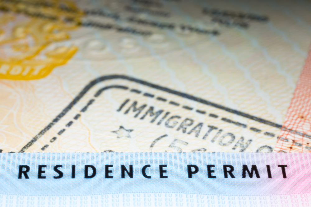 Immigration,Concept,Image.,Residence,Permit,Card,Over,Immigration,Stamp,On