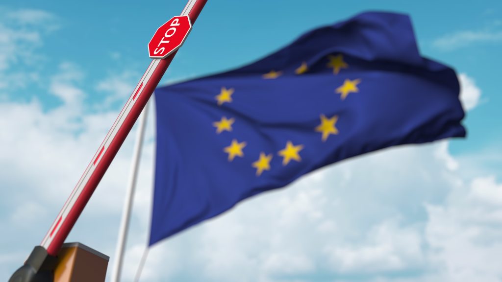 Barrier,Gate,Being,Opened,With,Flag,Of,The,Eu,As