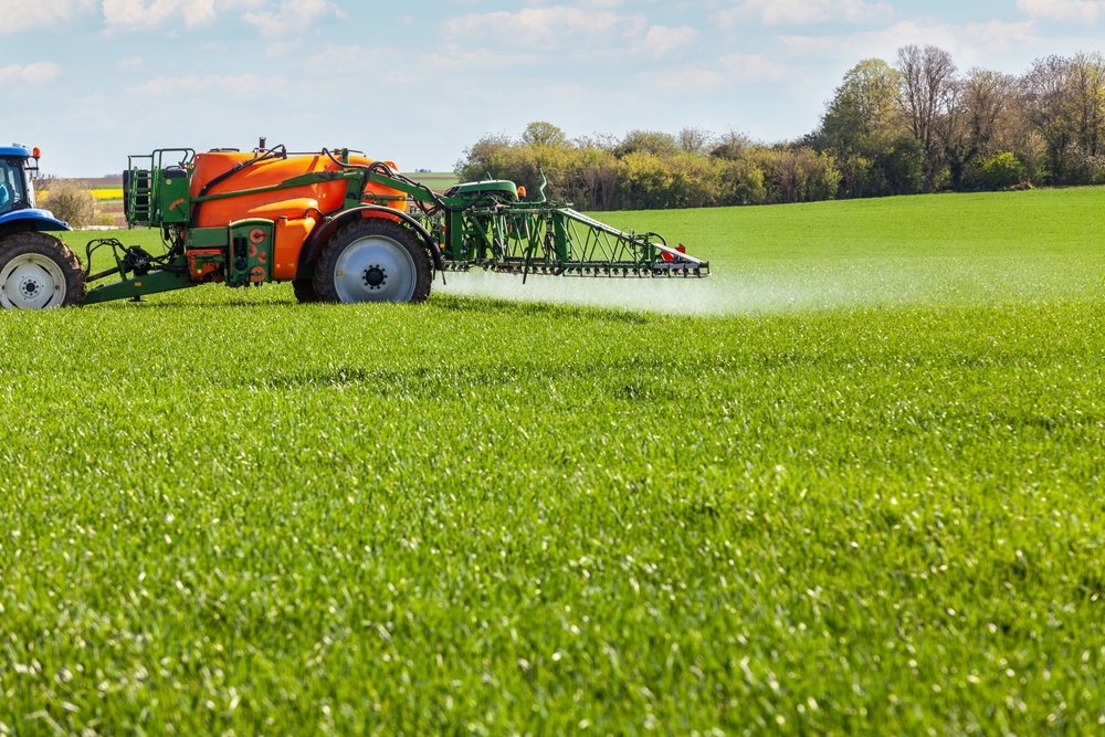 Conventional,Intensive,Agriculture,-,Spreading,Pesticide,On,A,Cereal,Field
