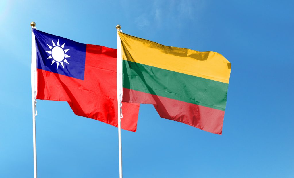 Taiwan,And,Lithuania,Flags,On,Cloudy,Sky.,Waving,In,The