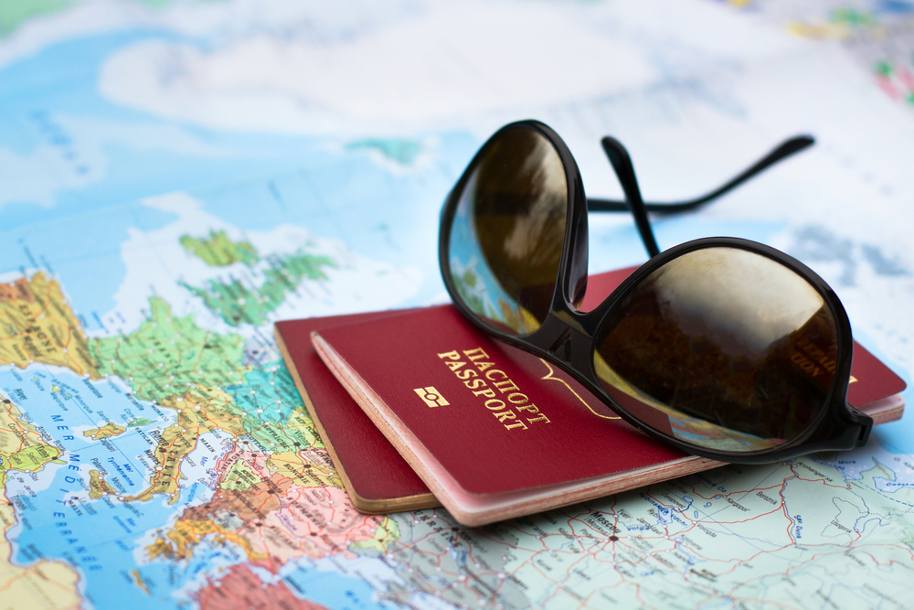 Travel,Concept,,Two,Passports,On,The,Map,Of,Europe