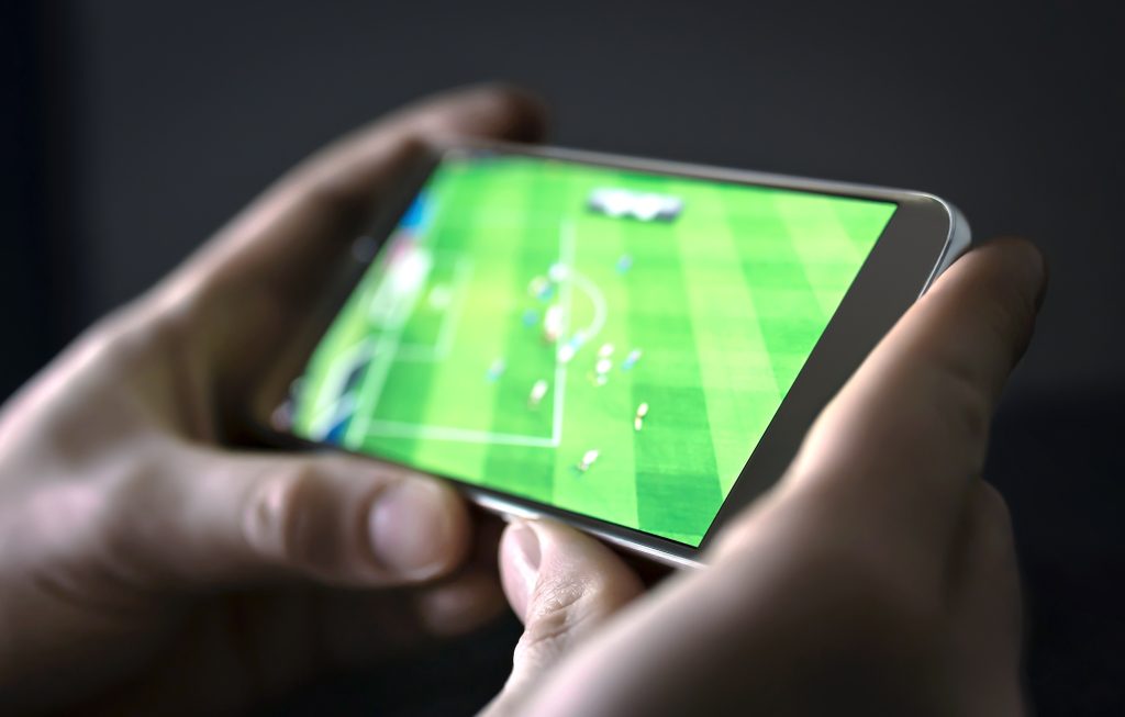 Watching,Football,And,Sport,Stream,With,Mobile,Phone.,Man,Streaming