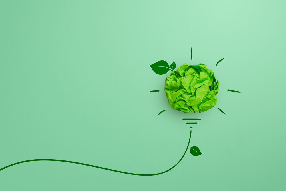 Green,Crumpled,Paper,Light,Bulb,On,Green,Background,,Corporate,Social