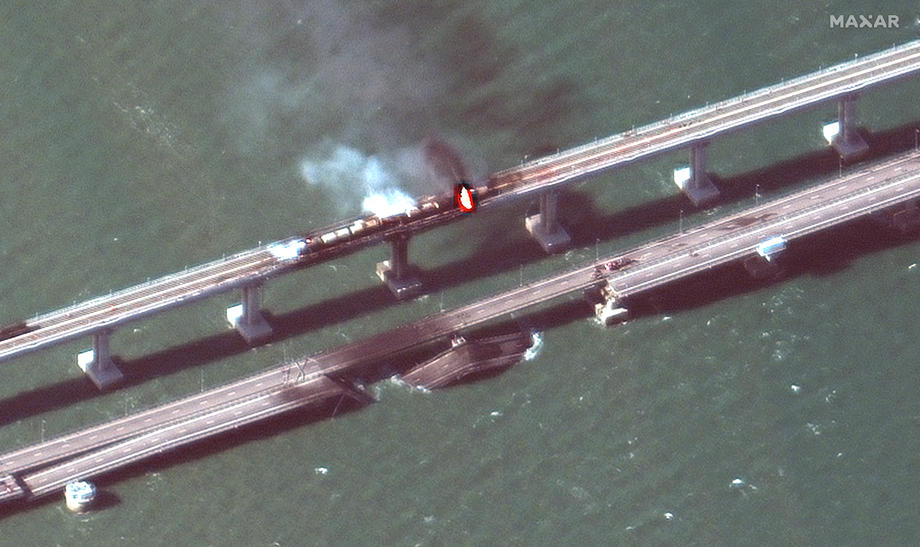 Parts of Crimea bridge collapse following fire