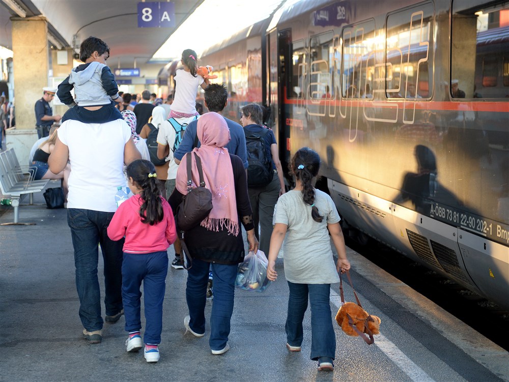 Migrants board trains in Vienna