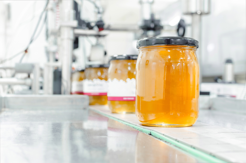 Image,Of,Jar,Full,With,Organic,Honey,,Production,In,Factory.