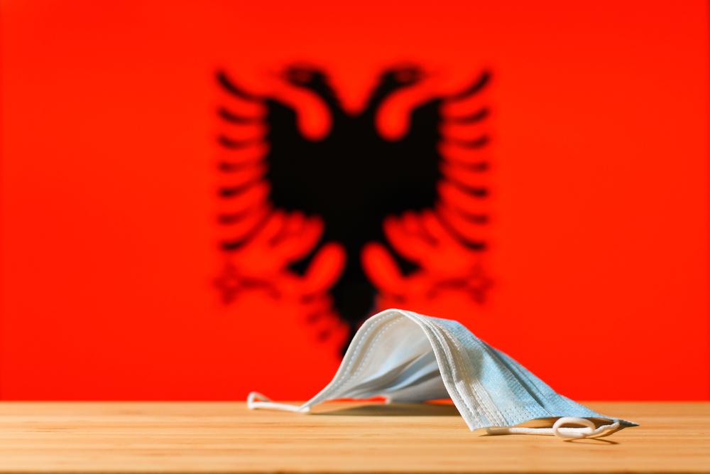A,Medical,Mask,Lies,On,The,Table,Against,The,Background