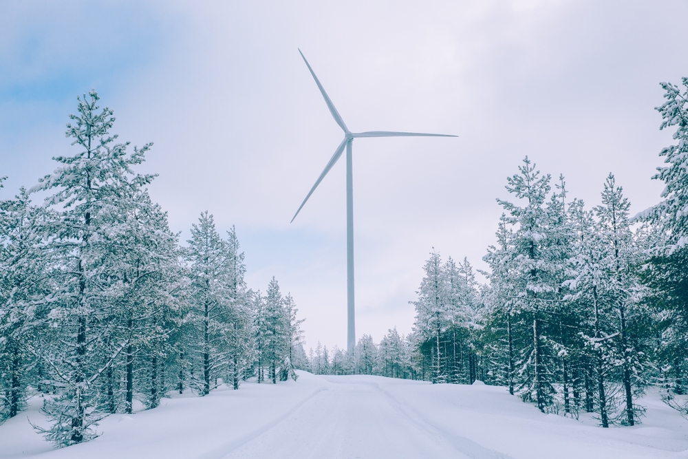 Aerial,View,Wind,Turbine,In,Snow,Winter,Landscape,In,Finland,