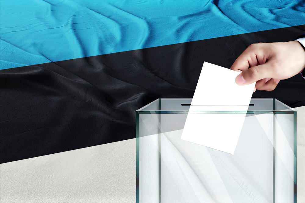 Estonia,Flag,,Estonia,The,Symbol,Of,Elections,Male,Hand,Puts