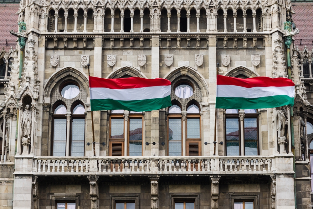 Detail,Of,Parliament,In,Budapest,,Hungary,,With,Waving,Hungarian,Flags