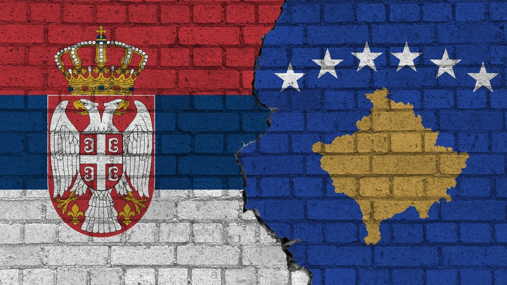 Serbia,Vs,Republic,Of,Kosovo,,Flags,On,A,Wall,With