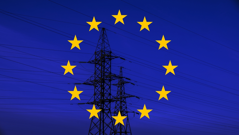 Eu,Flag,With,Electric,Tower,And,Lines.,Energy,Supply,In