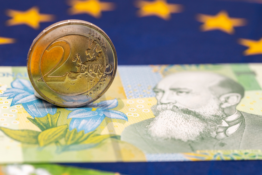 Romanian,Money,Next,To,A,2,Euro,Coin,,Concept,Of