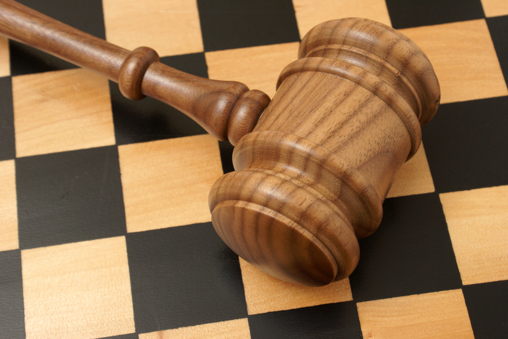 A,Wooden,Gavel,And,Chess,Board,Represent,Strategy,In,Legal