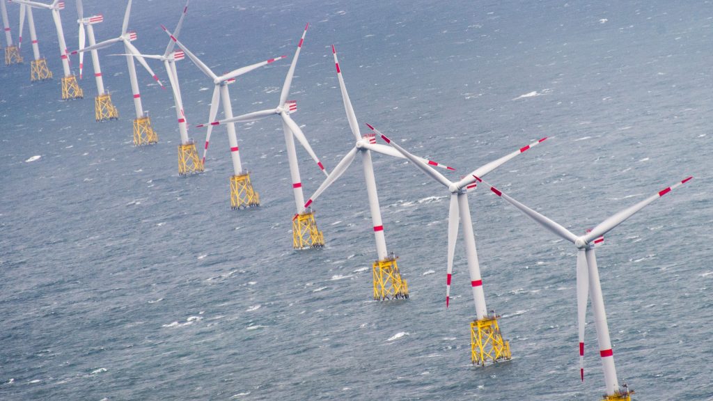 epa04929486 A picture made available on 14 September 2015 shows an aerial view of a row of wind turbines in the Offshore Windpark ‚Nordsee-Ost‘ off the North Sea island of Sylt, Germany, 04 September 2015.  EPA/Daniel Reinhardt