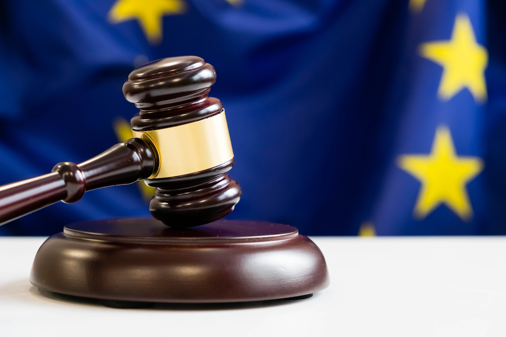 Judges,Wooden,Gavel,With,Eu,Flag,In,The,Background.,Symbol