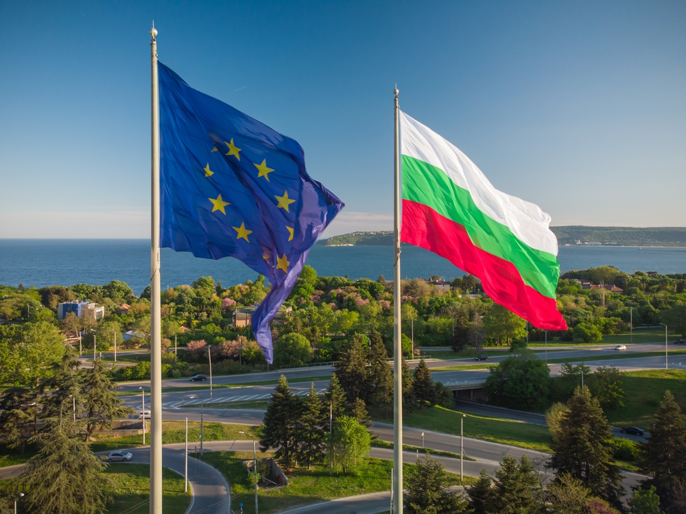 European,Union,And,Bulgaria,Flags,Against,City,Varna,And,Blue
