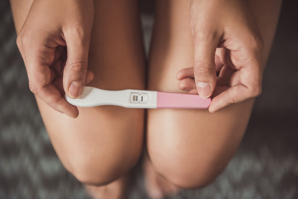 Cropped,Image,Of,Woman,Holding,A,Pregnancy,Test,On,Her