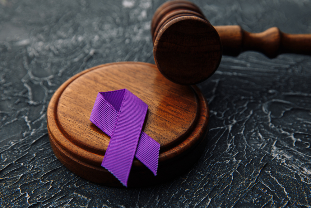 Violet,Ribbon,And,Gavel,On,Grey,Background,-,Concept,Of