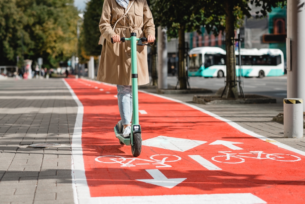Traffic,,City,Transport,And,People,Concept,-,Woman,Riding,Electric